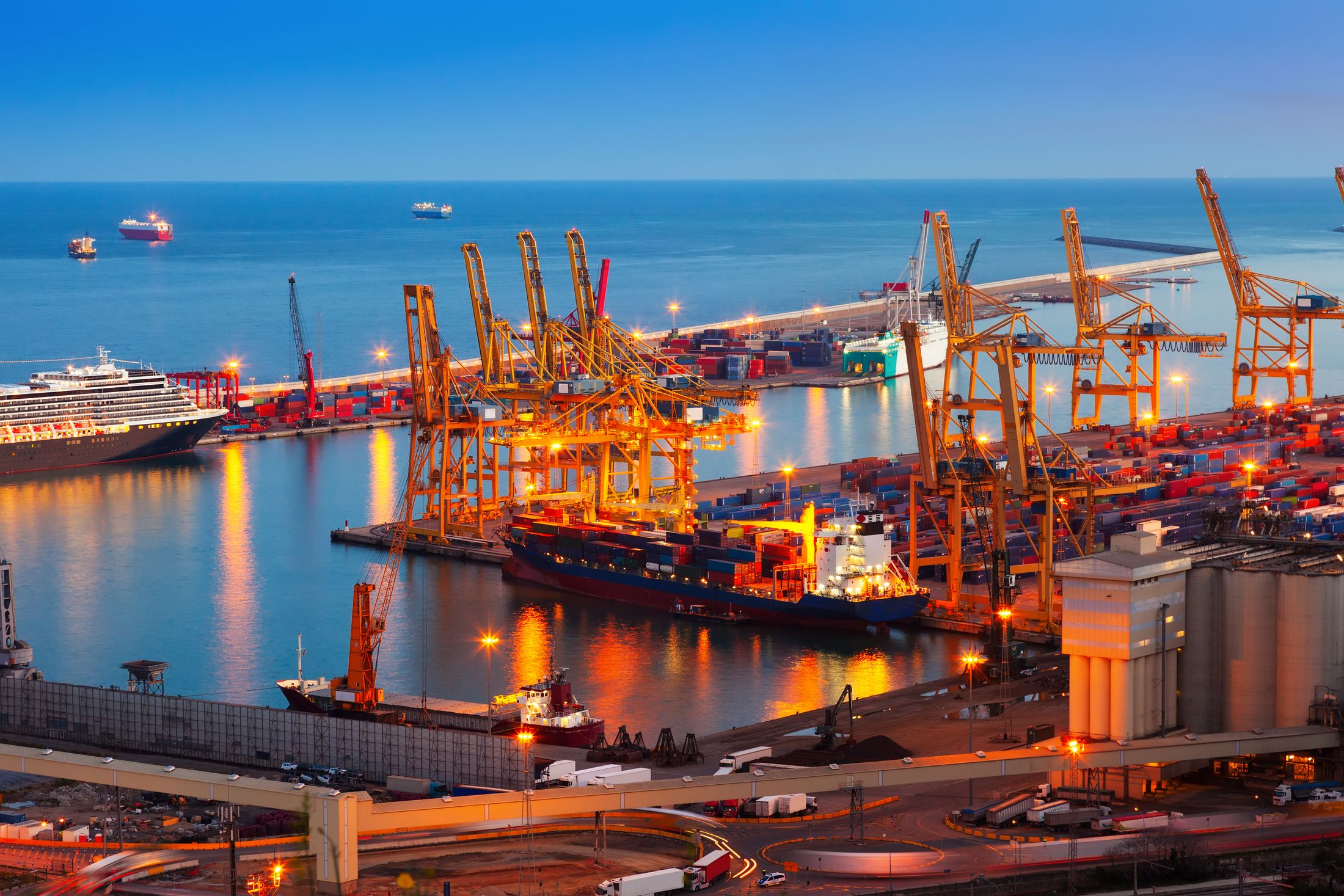 Container terminal with cranes at dusk
