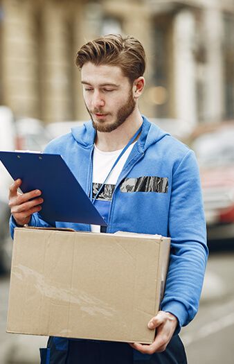 Logistics staff reviewing paperwork