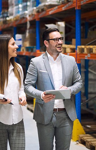 Logistics managers walking through a warehouse